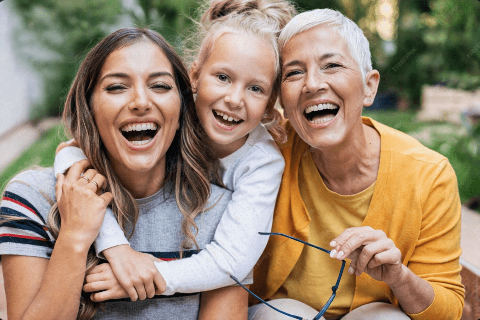 Three generations of a family laughing together — CDCP covers eligible Canadians of all ages