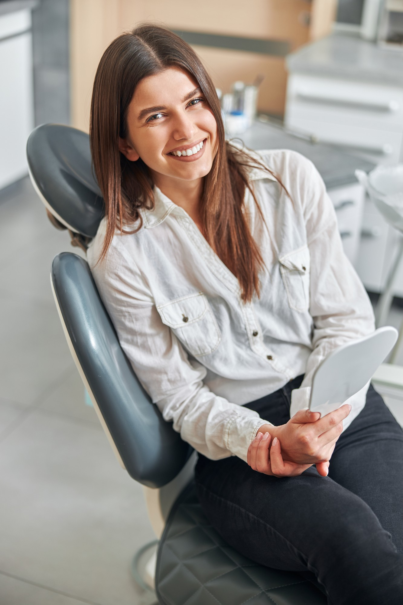 A smiling patient relaxing in the dental chair at High River Dental Centre